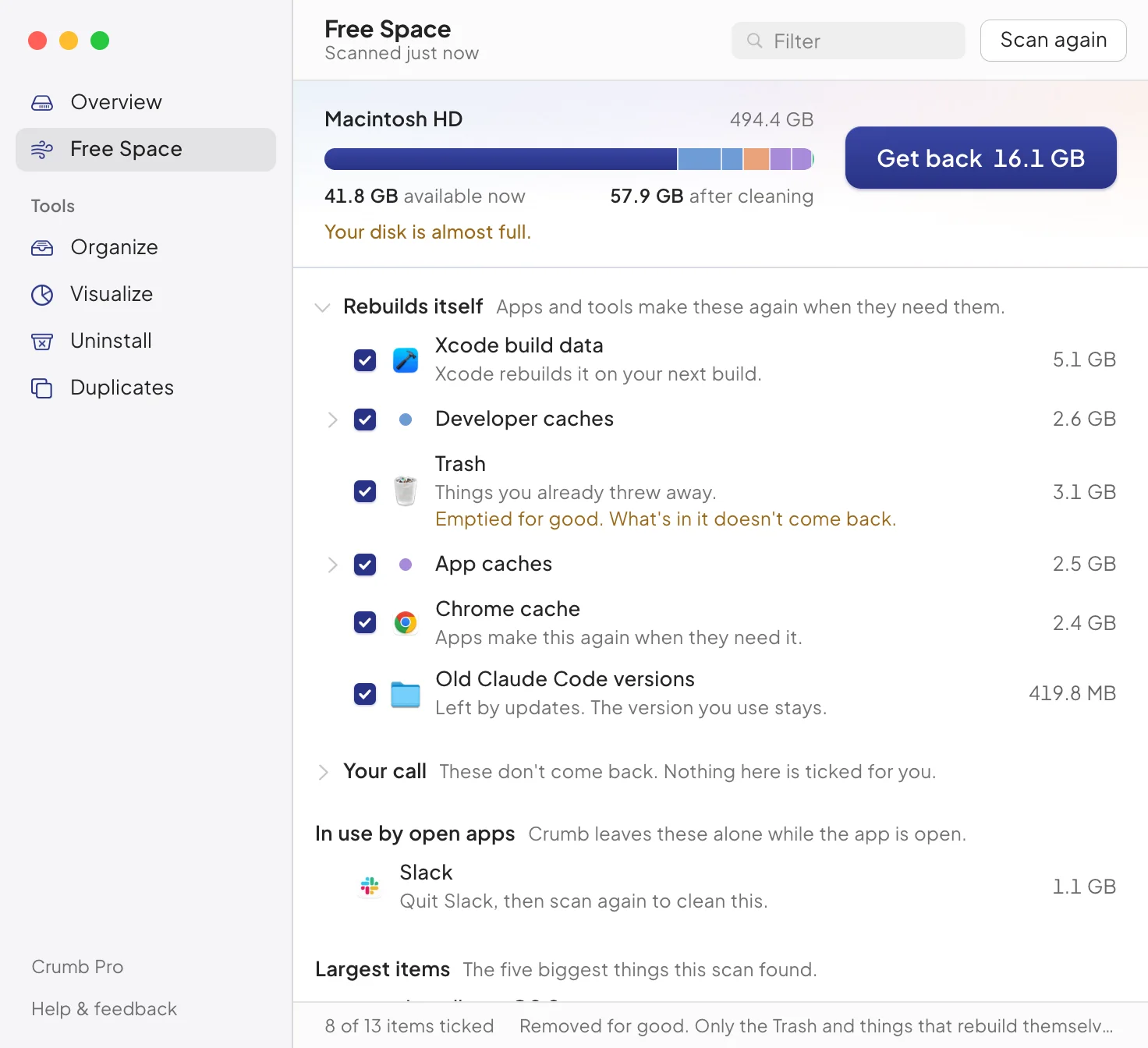 Free Space results: a Rebuilds itself section with Xcode build data, developer caches, the Trash, app caches and Chrome cache ticked, a closed Your call section, and Slack listed under In use by open apps